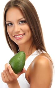 Smiling Young Woman, Holding an Avocado
