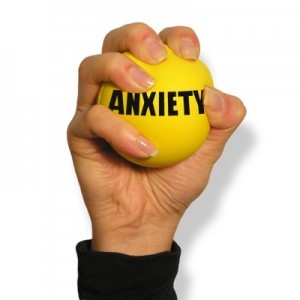 A photo of a woman squeezing a stress ball